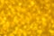 Delicate golden texture bokeh background. blurred yellow autumn background