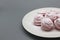 Delicate handmade pink marshmallows on a white plate