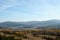 Delicate haze of morning mist over the valley. hilly landscape.