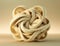 A delicate lattice of cream and tan twisting around each other. AI generation