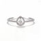 Delicate Pear Shaped Diamond Ring In High-key Lighting