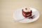 Delicate piece of small chocolate cake with shallow depth of field