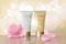 Delicate pink flower falling petals cosmetic ad. Beige white face cream rose blossom mask tube reflection package mockup