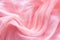 Delicate pink organza chiffon fabric background with swirl creased texture. Sewing fashion clothes making wedding
