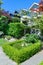 Delicately landscaped front yard of residential house.