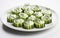 Delicately sliced cucumbers filled with creamy herb-infused cream creese.