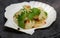 Delicatessen appetizer of fresh scallop with lemon or lime juice, chili pepper , red onion, cilantro, sesame and spices