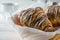 Delicioius sweet freshly baked croissants, macro closeup