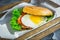 Delicious american hamburger with eggs, lettuce and salmon fish