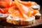 A delicious appetizer of fresh fish. Salmon or trout sandwich. Tender sandwich with fish bread and butter close-up