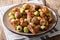 Delicious appetizer: roasted chestnuts, Brussels sprouts and bacon close-up. horizontal