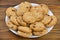 Delicious appetizing cookies with chocolate on plate