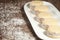 Delicious Argentinian cookies cornflow alfajores with cream dulce de leche close-up . White vanilla macaroons on white