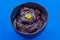 Delicious aÃ§ai bowl on blue background