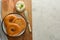 Delicious bagels with cream cheese on wooden board, pastry bread for breakfast. Top view. Copy space