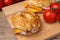 Delicious bagels with ham and cheese on table, closeup