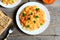 Delicious basmati rice with vegetables and parsley on a plate, vegetable salad on a plate, cracker, pumpkin puree in a bowl, fork