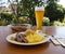 delicious bavarian fried sausages with a potato salad, sauerkraut and German wheat beer (weiss beer)