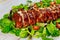 Delicious BBQ pork ribs with green salad and tangy BBQ sauce