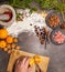 Delicious and beautiful handmade flat lay for christmas baking with chocolate chips, oranges, nuts, cinnamon cranberries vanilla