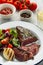 Delicious beef steak with salad. Sliced grilled beef barbecue wi