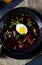 A Delicious beetroot borscht with egg