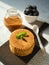 Delicious Belgian Dutch waffle cookies with mint on wooden board caramel sauce bowl of blackberries and spoon on natural color