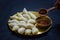 Delicious bengali rice flour coconut dumpling served during bengali indian festival of makar sankranti. hands eating dumplings