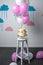 delicious birthday cake with balloons arranged