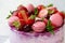 Delicious birthday cake with fresh strawberries, cherries, mint and french macaroons. Close-up