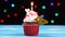 Delicious birthday cupcake with burning candle and number 44 on multicolored blurred lights background