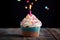 A delicious birthday cupcake and candle light. Generative AI