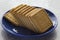 Delicious biscuits on a blue saucer and marble top