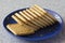 Delicious biscuits on a blue saucer and marble top