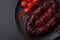 Delicious black blood sausage or black pudding with spices and herbs