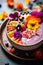 A delicious blend of fresh fruits and edible blooms in colorful smoothie bowl