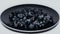 Delicious blueberries in black plate