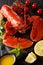 Delicious boiled lobster closeup with lemon, fresh tomatoes and