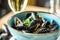 A delicious bowl of black mussels with white wine