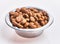 Delicious bowl of dog food balls over isolated white background