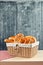 Delicious bread and rolls in wicker basket