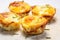 Delicious breakfast: baked egg muffin cups with bacon, cheese, and greens