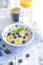 Delicious breakfast composition. Bowl of organic muesli with banana, linseeds, fresh berries , coffee, fover rustic wooden