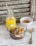 Delicious breakfast or snack - chocolate yogurt with granola and a banana and orange juice.