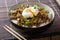 Delicious breakfast: spicy stewed minced meat with poached egg a
