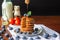 Delicious breakfast Sweet homemade stack of Oat pancakes with berries, honey, maple syrup, and milk bottle on wooden