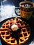 Delicious breakfast waffles with fresh berries plated