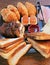 Delicious brunch - breakfast on wooden table with toast, cake, croissant, honey, marmalade, cheese and ham