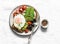 Delicious brunch - fried egg, avocado, grilled bread, dried olives, cherry tomatoes. Delicious healthy breakfast, snack on a light