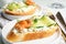 Delicious bruschettas with shrimps served, closeup